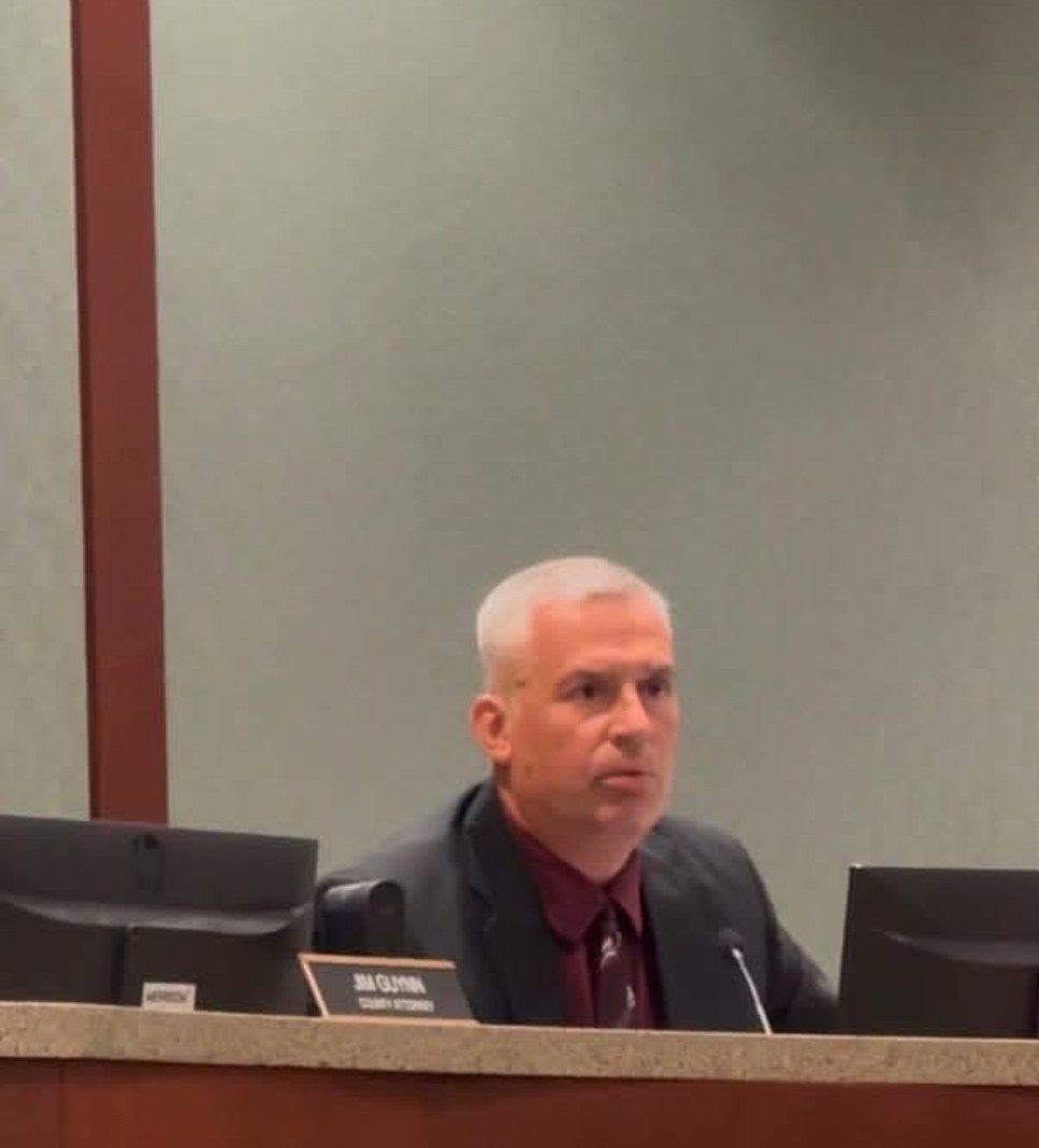 County Attorney Jim Guynn seated at the dais during a Board of Supervisors meeting