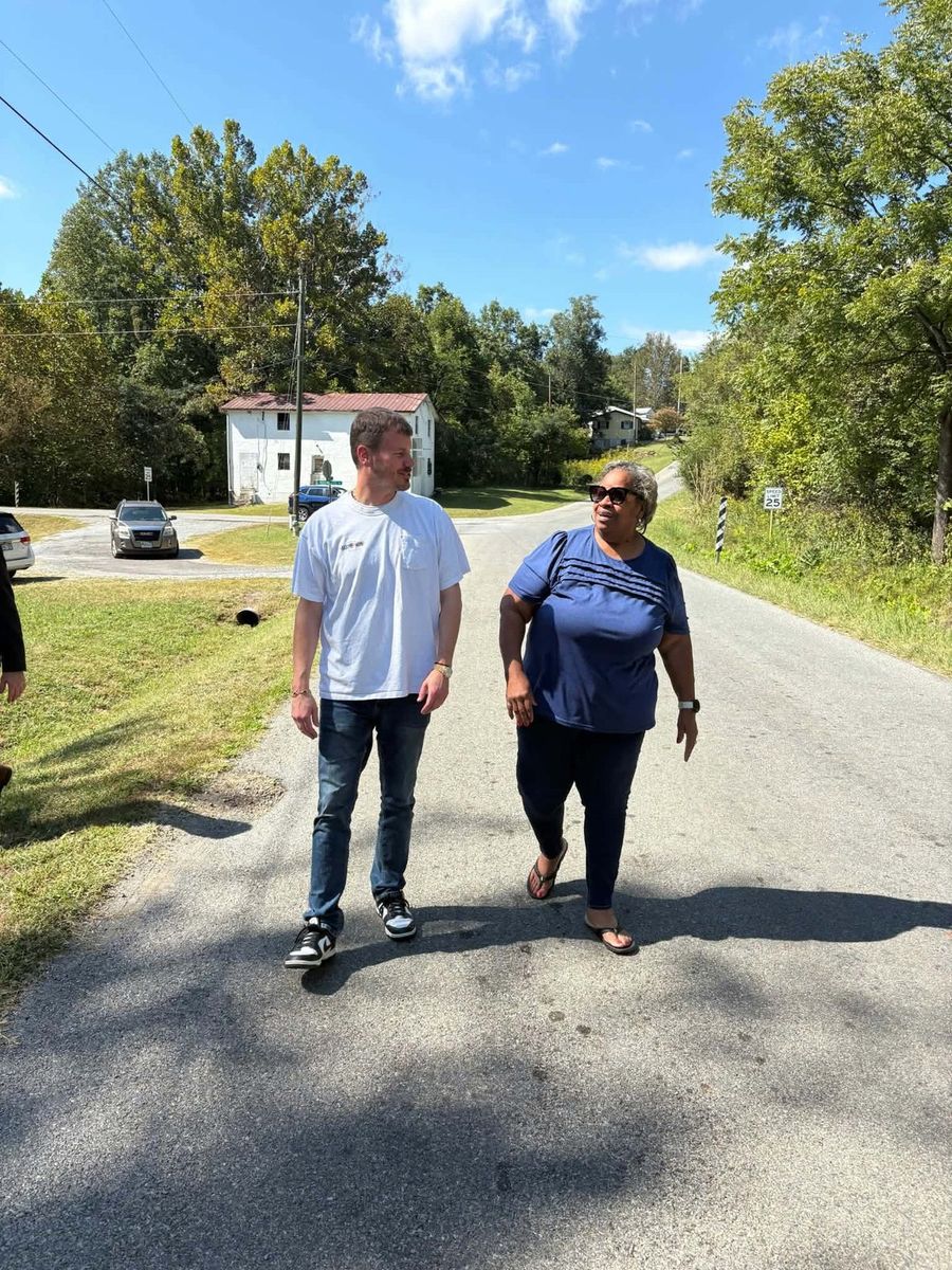 Mayor Holland Perdue and resident Sandra Poindexter Smith walk up Diamond Avenue.